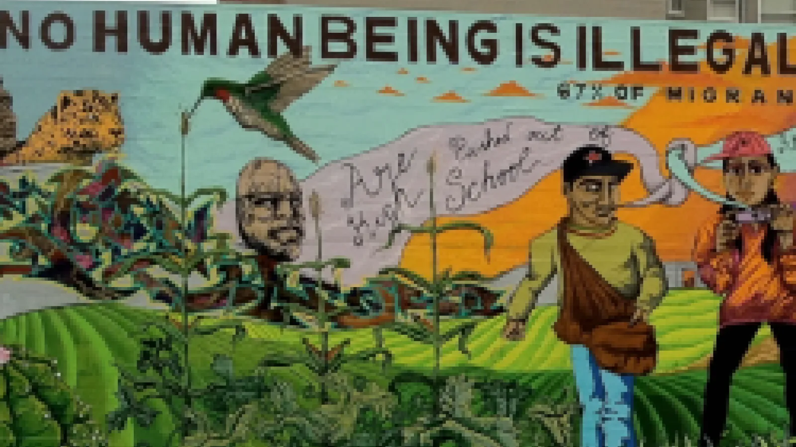 Mural stating that no human being is illegal