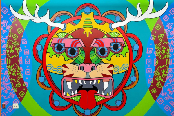A beast with four eyes and antlers and fangs