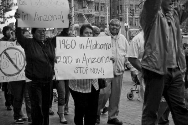 Rally Against SB1070 protesters with signs