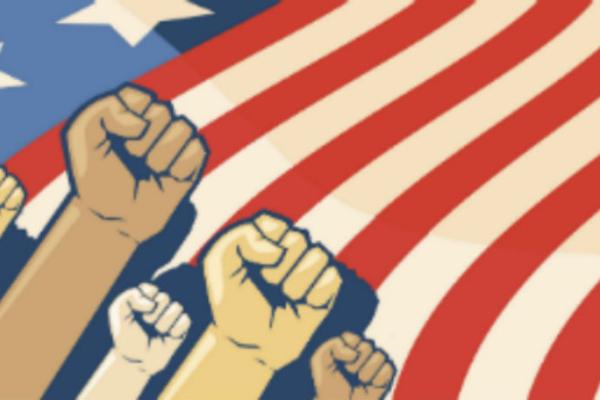 Fists of different colors in front of the American flag.