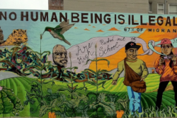 Mural stating that no human being is illegal