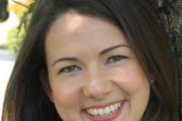 Smiling woman with dark brown hair